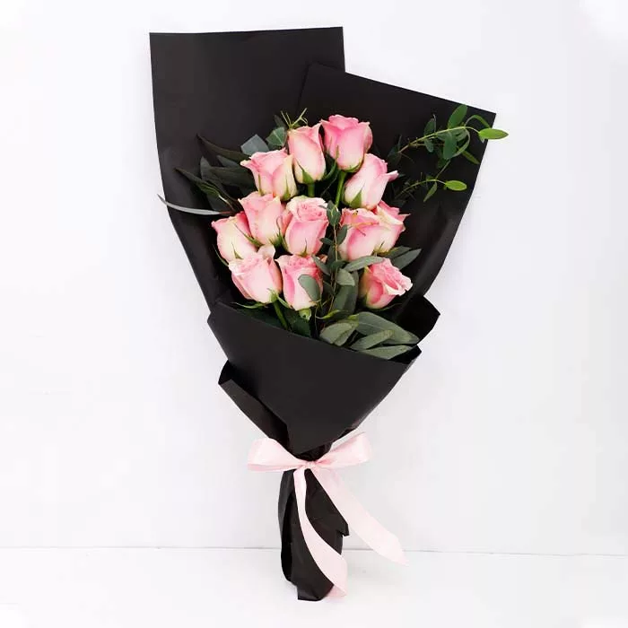 12 pink roses in balck wrapping jpg