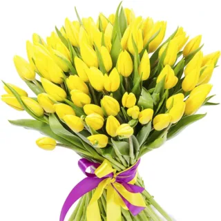 A large bouquet of yellow tulips tied with a purple ribbon