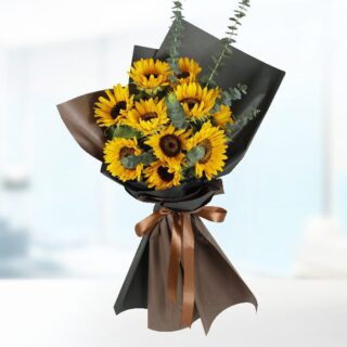 A bouquet of 10 sunflowers wrapped in black paper with a brown ribbon.