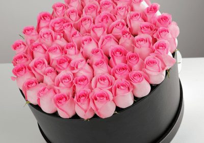 charming pink roses in a box
