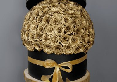 golden roses in a black box