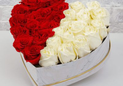 half red and white roses in marbled box