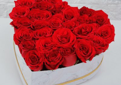 red roses in heart shaped marbled box