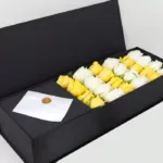 white_yellow_roses_in_black_box.jpg