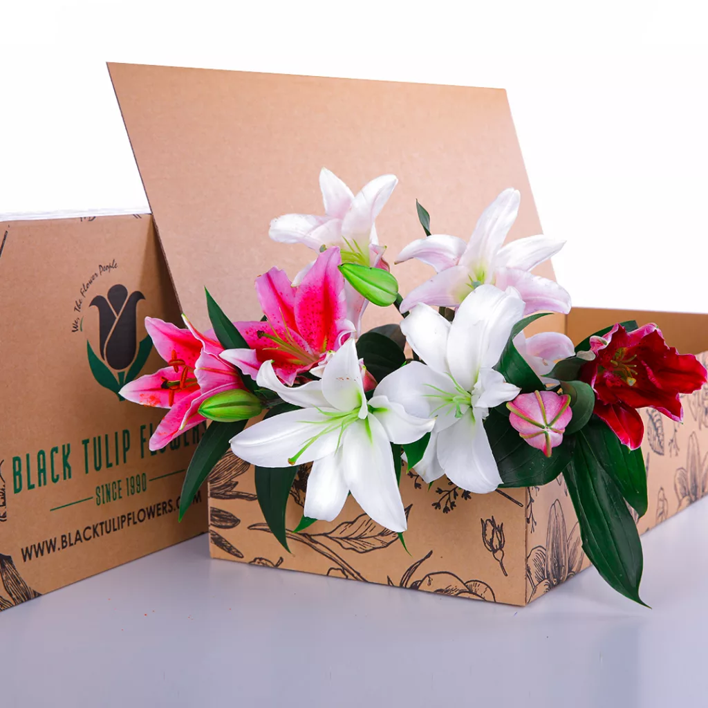 Lilies Mix A Mixed bouquet of pink and white lilies, arranged in a cardboard box.