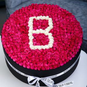 Brilliant Round Arrangement by Black Tulip Flowers