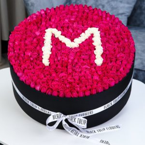 Marvelous Round Arrangement in a Box by Black Tulip Flowers