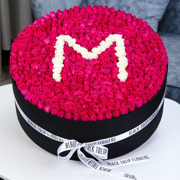 Marvelous Round Arrangement in a Box by Black Tulip Flowers
