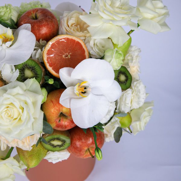 Peaceful Fruit Arrangement composed of mix fruits and flowers in a box by Black Tulip Flowers.