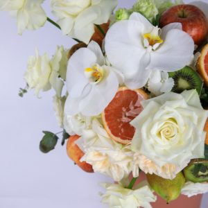 Peaceful Fruit Arrangement composed of mix fruits and flowers in a box by Black Tulip Flowers.