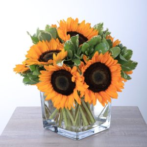 Shining Centerpiece with sunflowers by Black Tulip Flowers