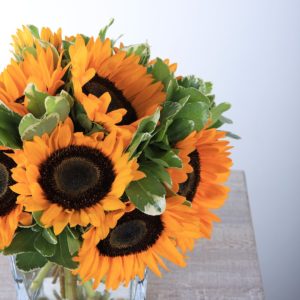 Shining Centerpiece with sunflowers by Black Tulip Flowers