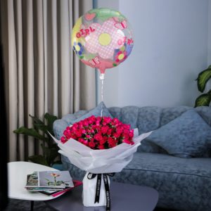 Striking Pink with Baby Girl Balloon by Black Tulip Flowers