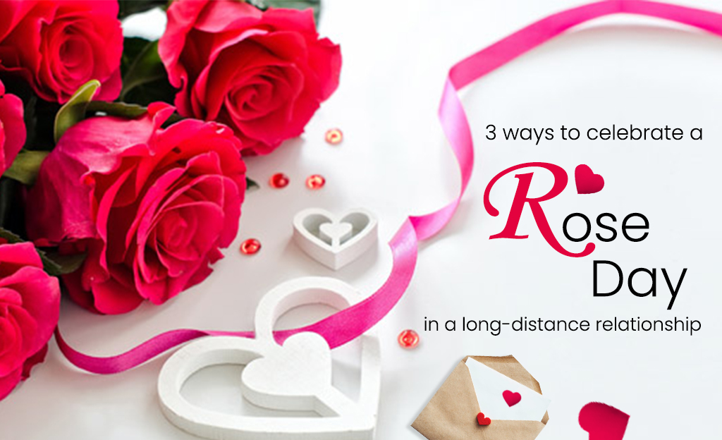 A bouquet of red roses arranged on a white surface with a pink ribbon, white hearts, and a small envelope with a red heart. The text "3 ways to celebrate a Rose Day in a long-distance relationship" is also included