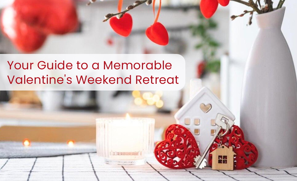 A Valentine's Day themed image with a candle, decorative hearts, a small house figurine, and keys. The text "Your Guide to a Memorable Valentine's Weekend Retreat" is displayed above the image