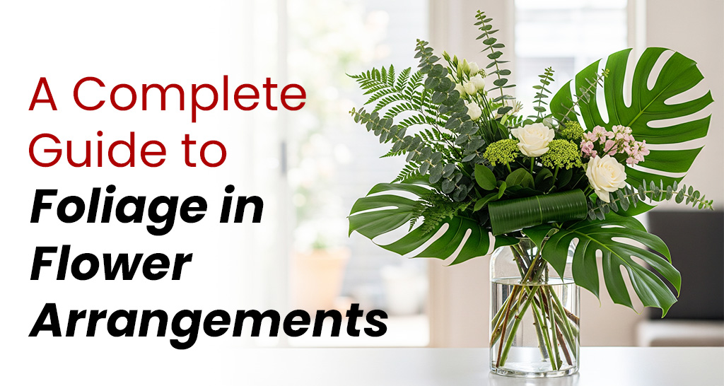 A variety of floral foliage displayed in a styled arrangement, showcasing different leaf textures, shapes, and greenery used in flower arrangements for a complete guide.