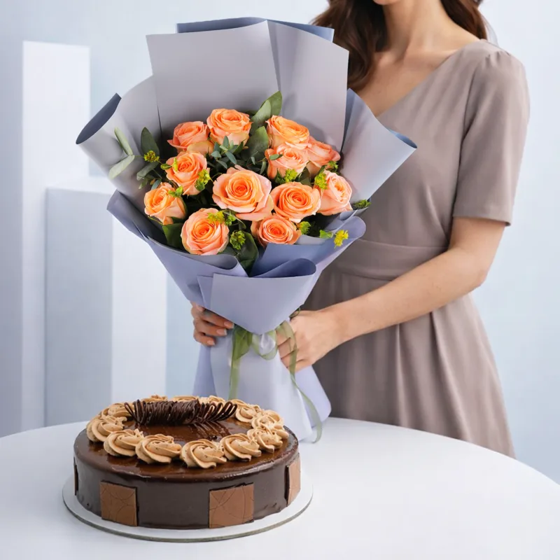 orange-rose-chocolate-cake-duo A gift featuring a bright orange rose bunch placed neatly beside a chocolate crunch cake arranged as a floral and dessert combo.