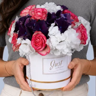 Stylish floral gift box with premium roses and hydrangeas paired with festive Eid wishes topper design