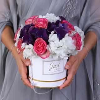 Stylish floral gift box with premium roses and hydrangeas paired with festive Eid wishes topper design