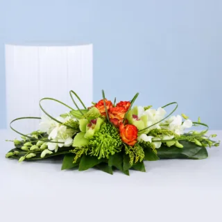 Premium centrepiece with orchids, roses, and chrysanthemums for elegant table styling at weddings, receptions, and interiors