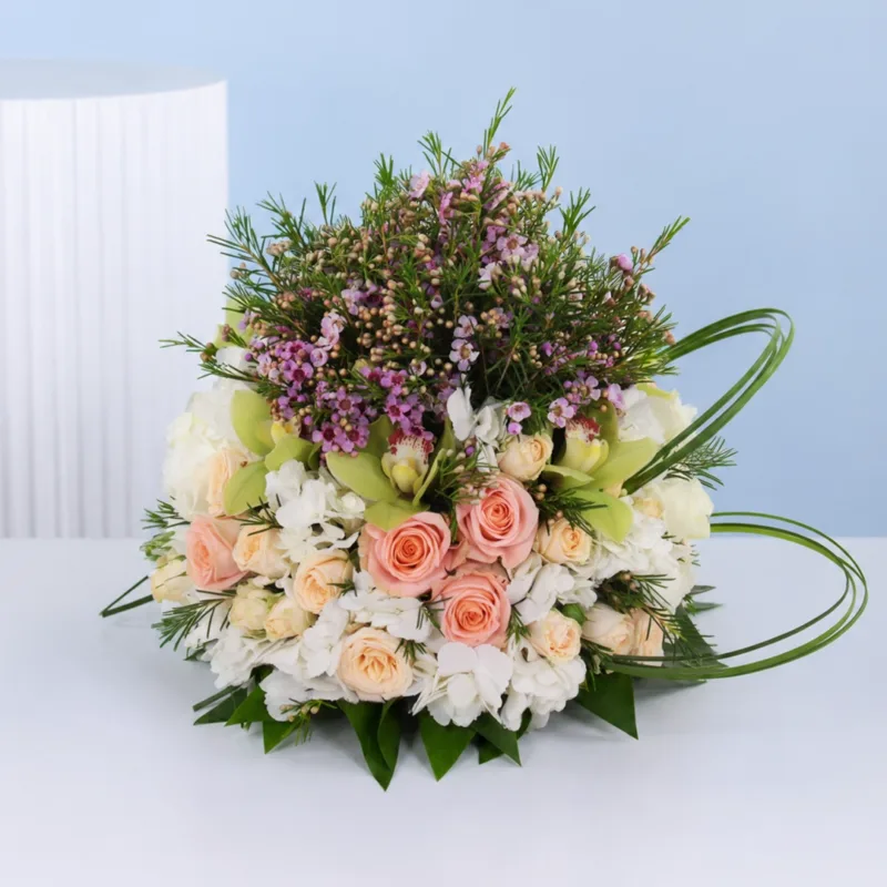 peach-rose-table-centrepiece Sophisticated peach floral table décor featuring roses, orchids, hydrangeas, and wax flowers for luxury event styling