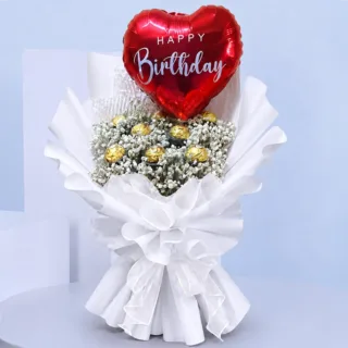 White gypsophila flower bouquet paired with 9 Ferrero Rocher chocolates and a red heart-shaped Happy Birthday balloon for a joyful birthday gift.