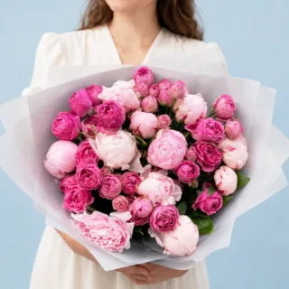 BTF Home 10 Premium hand-tied bouquet of fresh peonies showcasing a blend of blush and rose-coloured petals in a white wrapper.