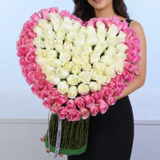 Statement rose bouquet overflowing with pink and white blooms, expertly arranged to convey elegance, celebration, and heartfelt sentiment.