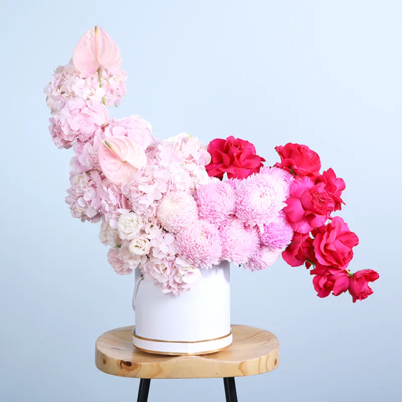 floral-grandeur-hat-box Floral Grandeur Hat Box featuring dark pink roses, light pink hydrangeas, lisianthus, and elegant pink blooms beautifully arranged in a premium hat box.