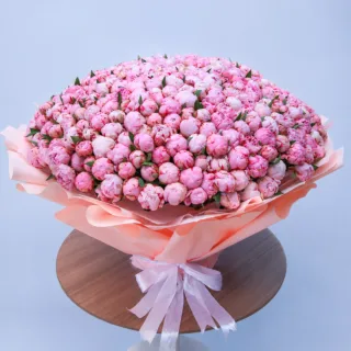 Grand Pink Peony Bouquet featuring fresh pink peonies beautifully arranged in a luxurious hand bouquet.